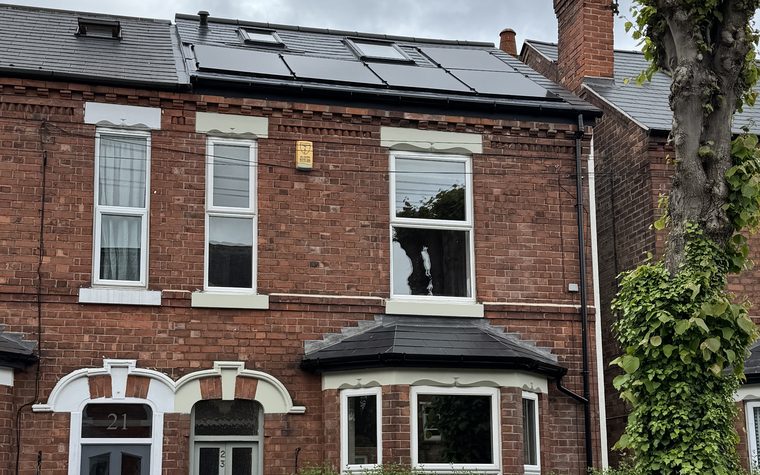 The Lady Bay house with in-roof solar panels on the new roof