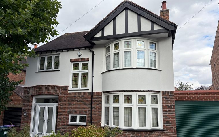 The front of the West Bridgford house after external wall insulation, with brick slips and render
