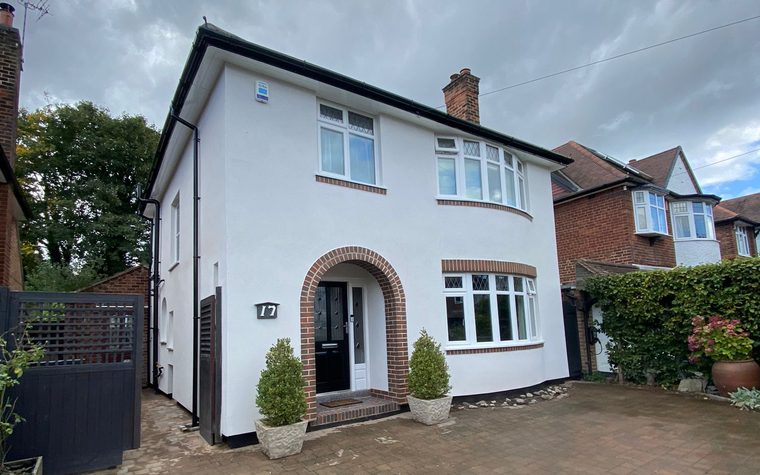 Ian and Louise's house after external wall insulation, with a brick slip arch around the front door